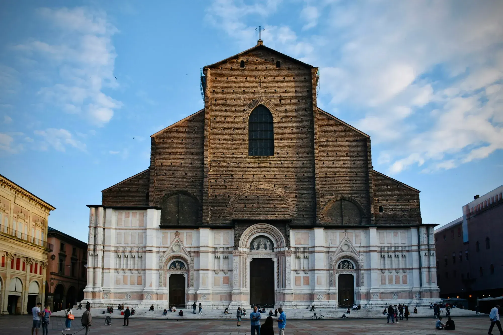 The façade of the Basilica of San Petronio in Bologna, with marble on the lower part and unfinished bare brick above