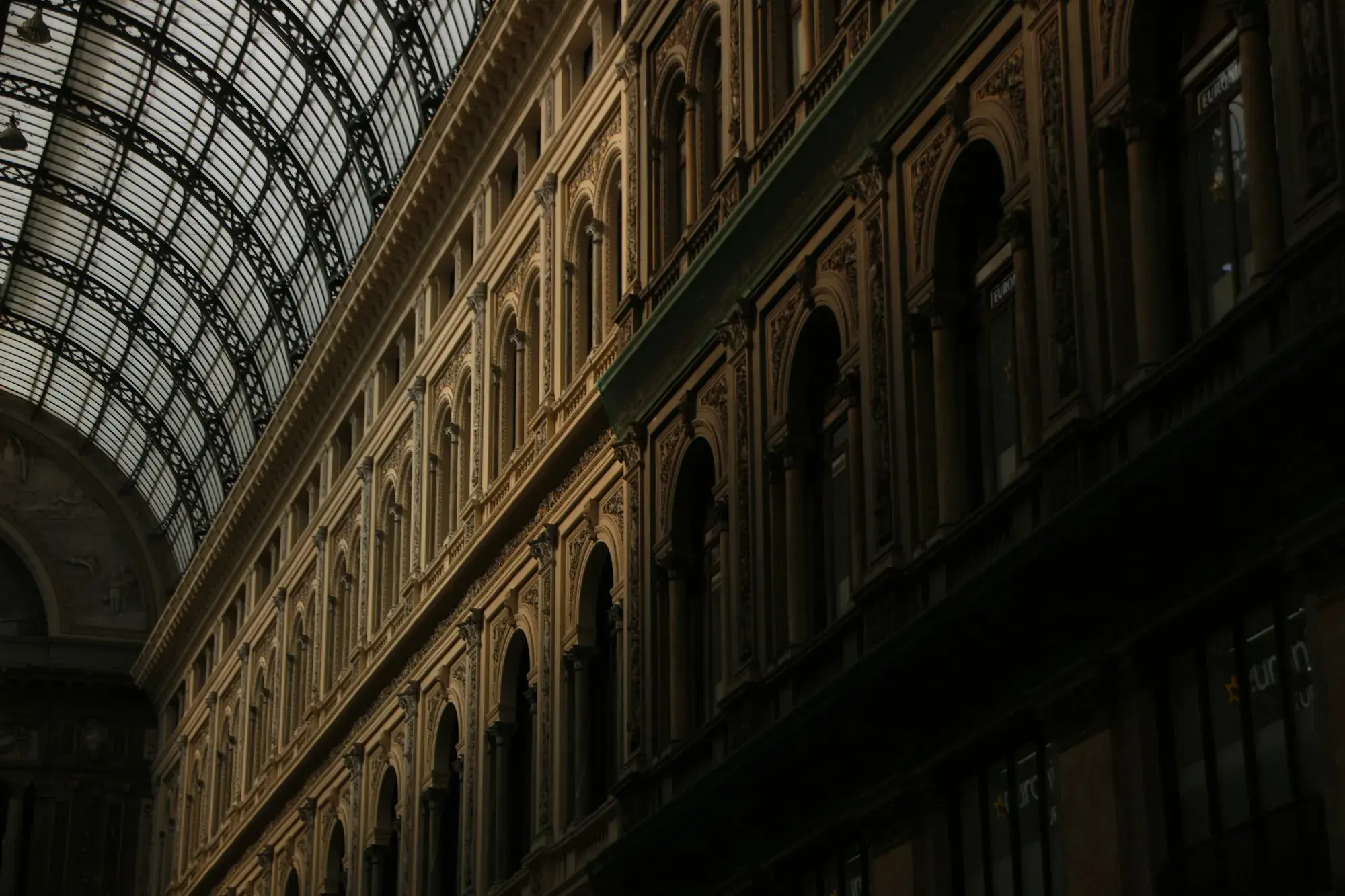 The glass and iron dome of the Galleria Umberto I shopping arcade in Naples