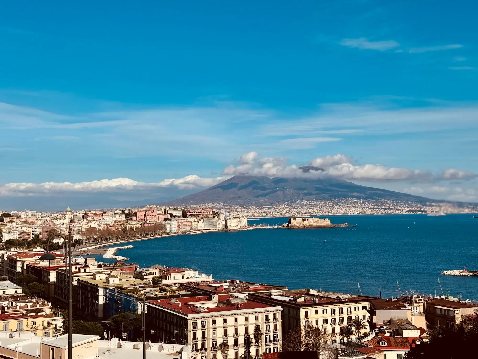 Naples and its bay seen from the hills, with Mount Vesuvius across the water