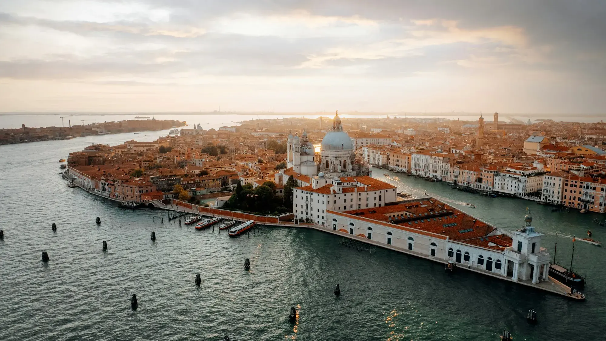 Aerial view of the tip of Dorsoduro in Venice, with Punta della Dogana and the dome of Santa Maria della Salute, the lagoon on both sides