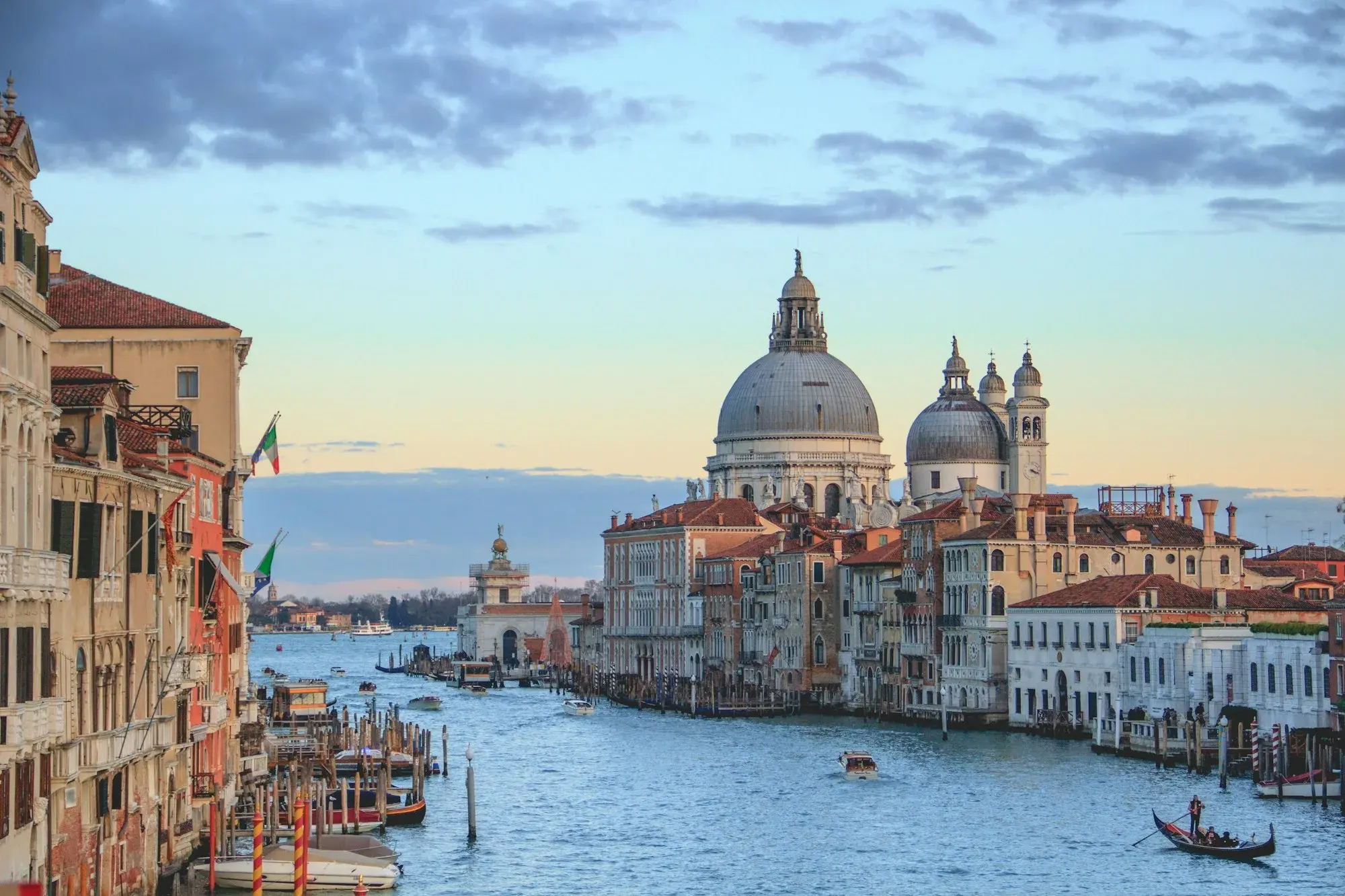 The Grand Canal seen from the Accademia Bridge at dusk, with the domes of Santa Maria della Salute at the end