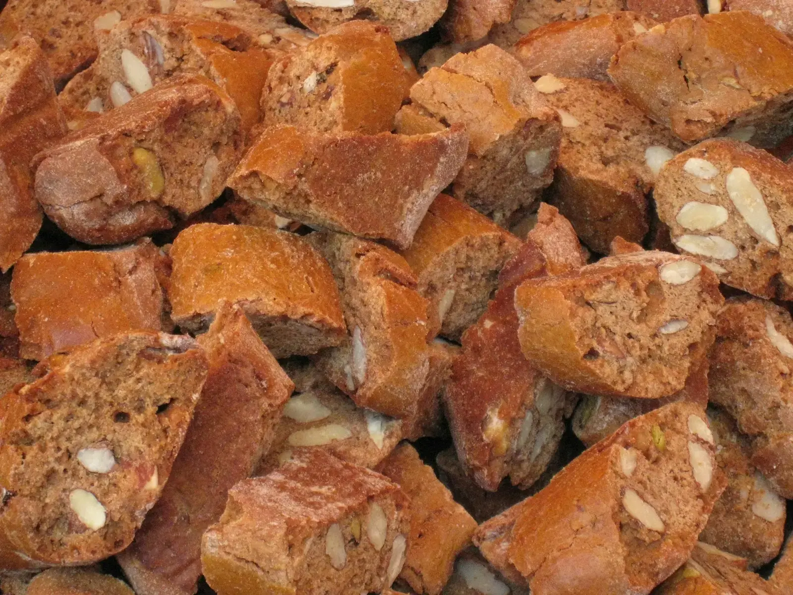 A pile of crunchy almond biscuits studded with whole nuts at a market stall in Verona