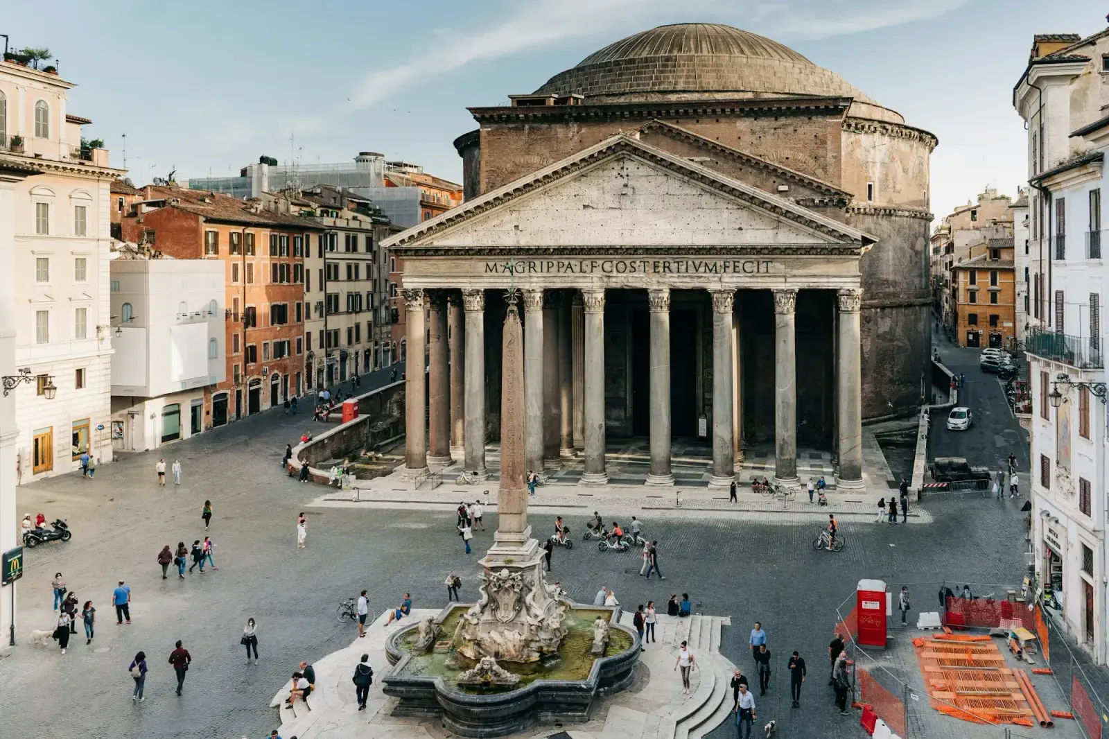 The portico of the Pantheon in Rome, with its granite columns and dome, facing Piazza della Rotonda and its fountain